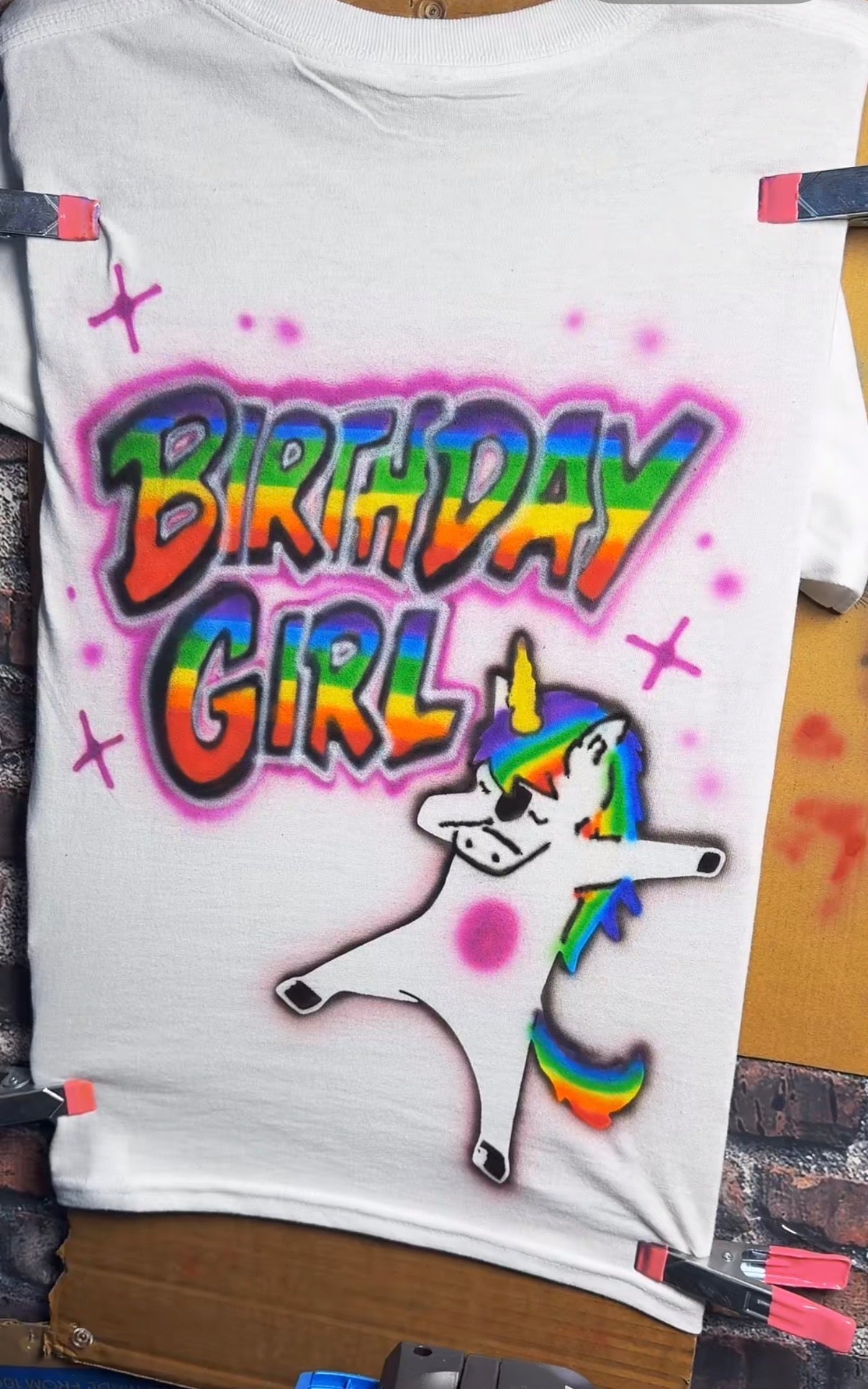 Birthday girl dabbing unicorn airbrush